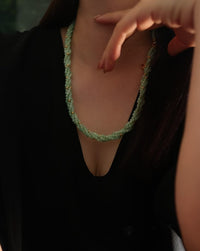 Lucky Jade Braided Necklace and Bracelet Set featuring genuine jade beads in an intricate braided design with gold-tone accents, convertible into a longer necklace.