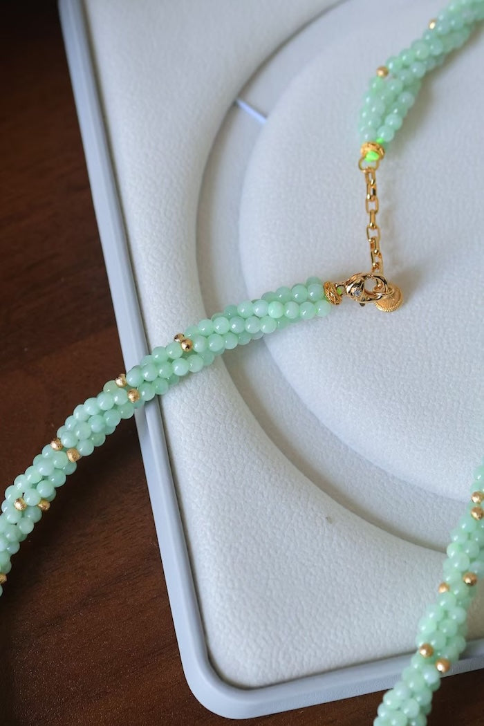 Lucky Jade Braided Necklace and Bracelet Set featuring genuine jade beads in an intricate braided design with gold-tone accents, convertible into a longer necklace.