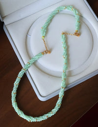 Lucky Jade Braided Necklace and Bracelet Set featuring genuine jade beads in an intricate braided design with gold-tone accents, convertible into a longer necklace.