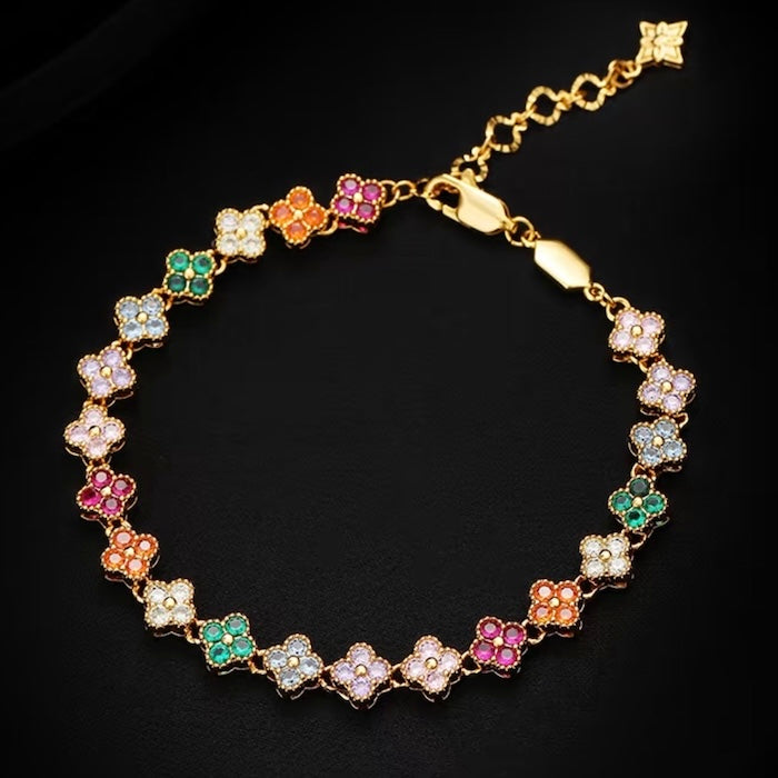 Kaleidoscope Clover Crystal Bracelet featuring gold-plated brass with multicoloured four-leaf clover motifs set with premium zirconia crystals and an adjustable chain.