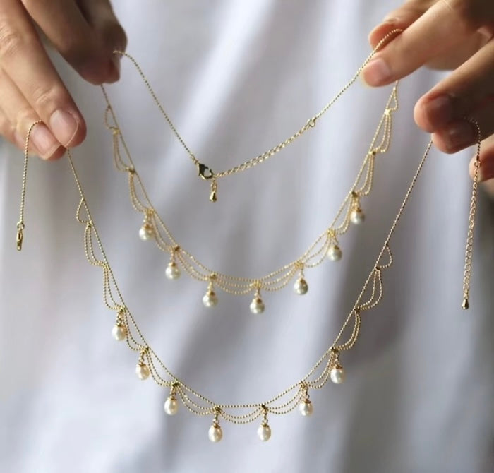 Lace Style Necklace with Genuine Freshwater Pearls featuring delicate layered chains and genuine baroque pearl drops in gold and silver-tone finishes, available in 3-pearl and 7-pearl designs.
