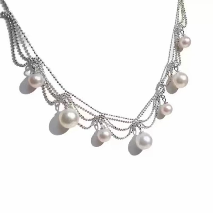 Lace Style Necklace with Genuine Freshwater Pearls featuring delicate layered chains and genuine baroque pearl drops in gold and silver-tone finishes, available in 3-pearl and 7-pearl designs.
