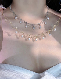 Lace Style Necklace with Genuine Freshwater Pearls featuring delicate layered chains and genuine baroque pearl drops in gold and silver-tone finishes, available in 3-pearl and 7-pearl designs.
