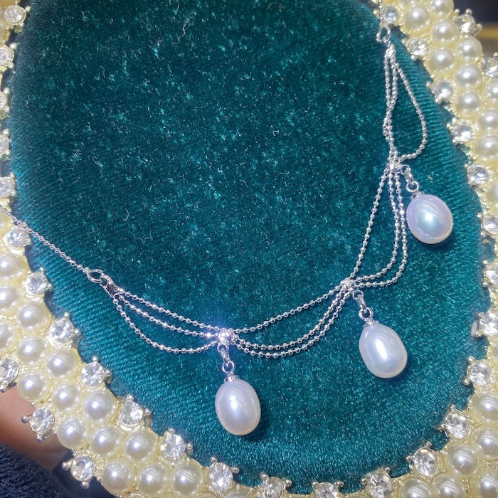 Lace Style Necklace with Genuine Freshwater Pearls featuring delicate layered chains and genuine baroque pearl drops in gold and silver-tone finishes, available in 3-pearl and 7-pearl designs.
