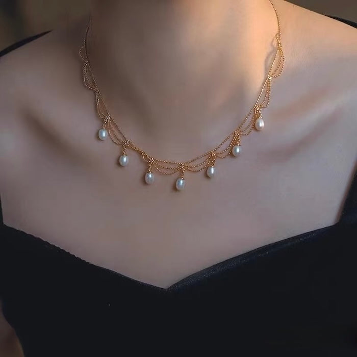Lace Style Necklace with Genuine Freshwater Pearls featuring delicate layered chains and genuine baroque pearl drops in gold and silver-tone finishes, available in 3-pearl and 7-pearl designs.
