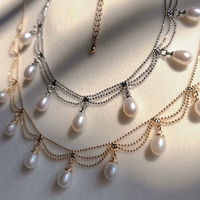 Lace Style Necklace with Genuine Freshwater Pearls featuring delicate layered chains and genuine baroque pearl drops in gold and silver-tone finishes, available in 3-pearl and 7-pearl designs.
