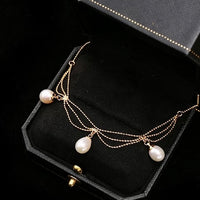 Lace Style Necklace with Genuine Freshwater PearlsLace Style Necklace with Genuine Freshwater Pearls featuring delicate layered chains and genuine baroque pearl drops in gold and silver-tone finishes, available in 3-pearl and 7-pearl designs.
