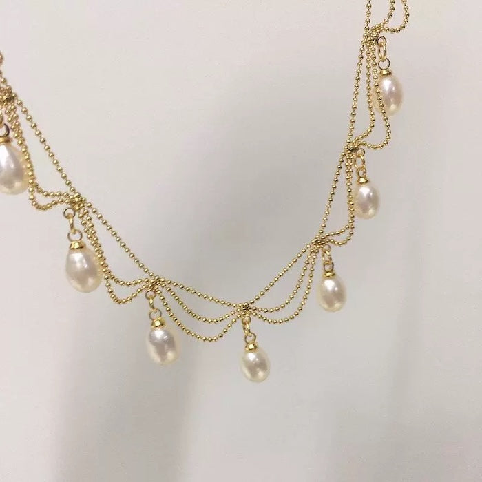 Lace Style Necklace with Genuine Freshwater Pearls featuring delicate layered chains and genuine baroque pearl drops in gold and silver-tone finishes, available in 3-pearl and 7-pearl designs.
