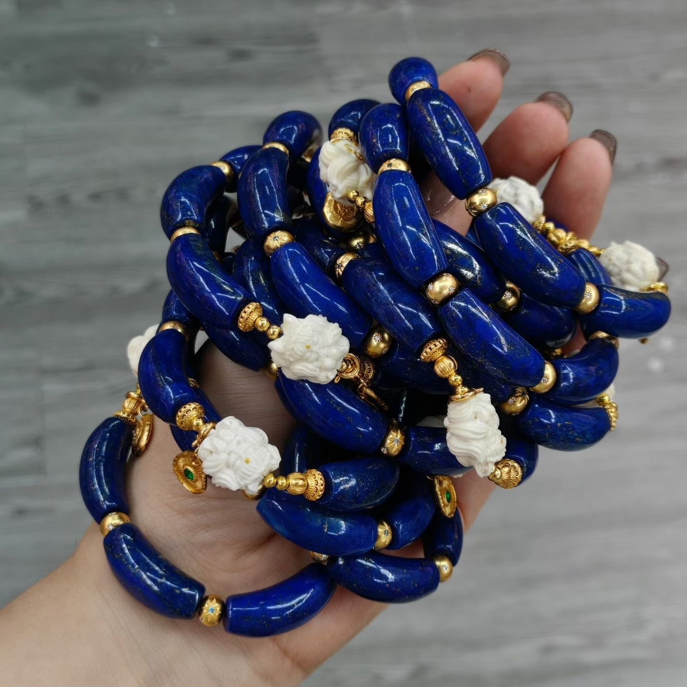Imperial Lapis Lazuli Guardian Bracelet featuring genuine curved lapis lazuli beads, a hand-carved guardian bead, and gold vermeil accents in a handcrafted vintage-inspired design.

