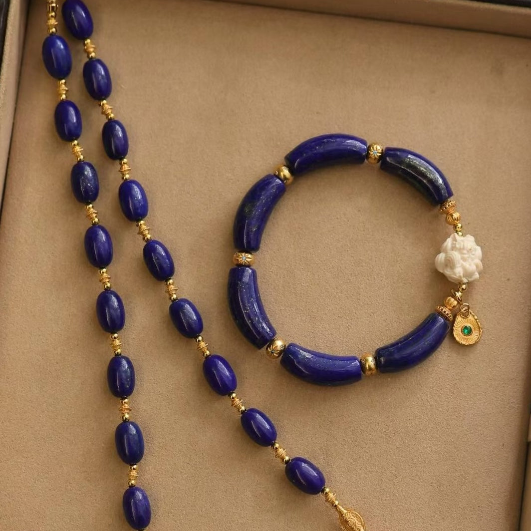 Imperial Lapis Lazuli Guardian Bracelet featuring genuine curved lapis lazuli beads, a hand-carved guardian bead, and gold vermeil accents in a handcrafted vintage-inspired design.

