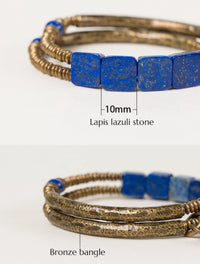Lapis Lazuli Square Bead Bracelet featuring genuine deep-blue lapis lazuli square beads, layered bronze-toned bangles, and a vintage-inspired charm.