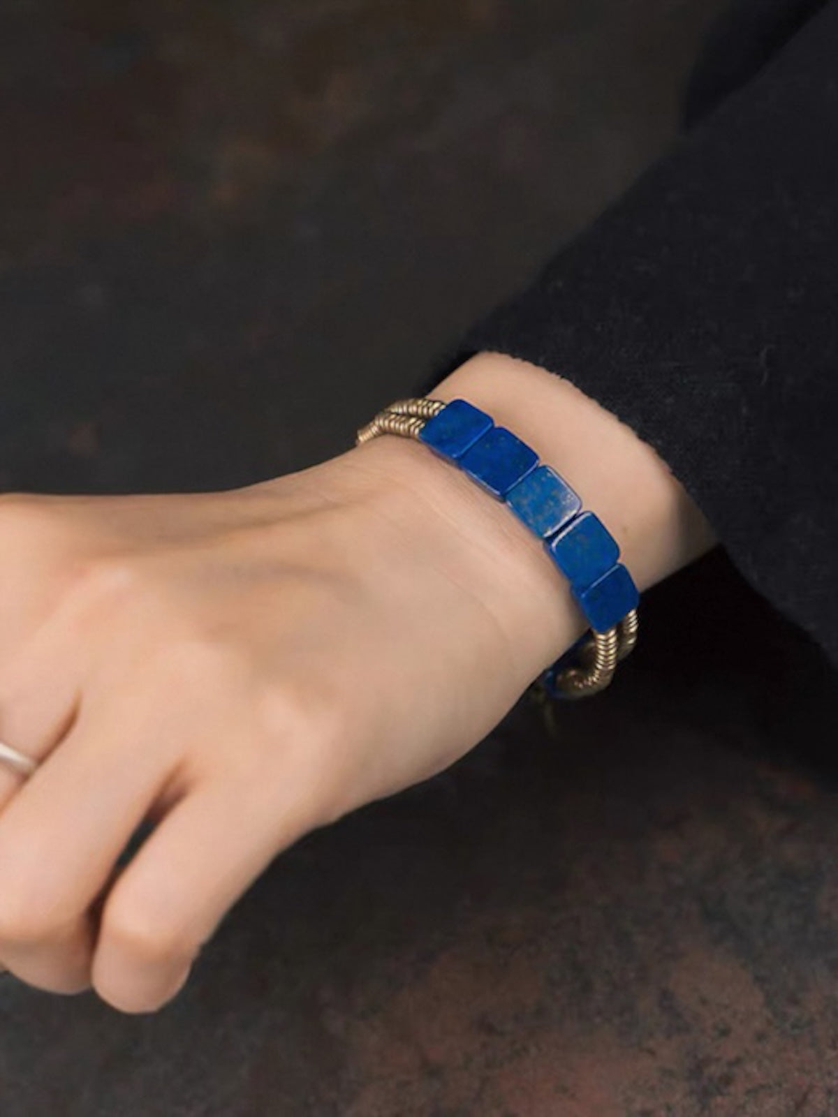 Lapis Lazuli Square Bead Bracelet featuring genuine deep-blue lapis lazuli square beads, layered bronze-toned bangles, and a vintage-inspired charm.