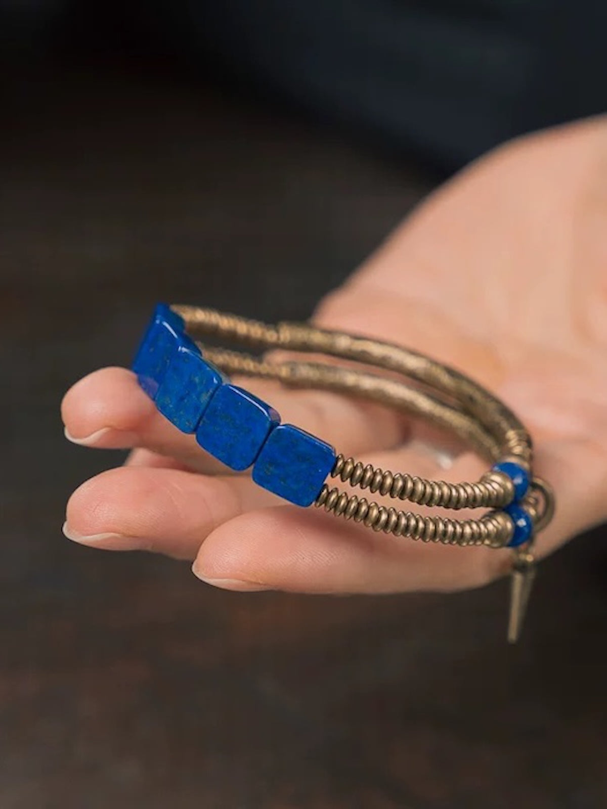 Lapis Lazuli Square Bead Bracelet featuring genuine deep-blue lapis lazuli square beads, layered bronze-toned bangles, and a vintage-inspired charm.