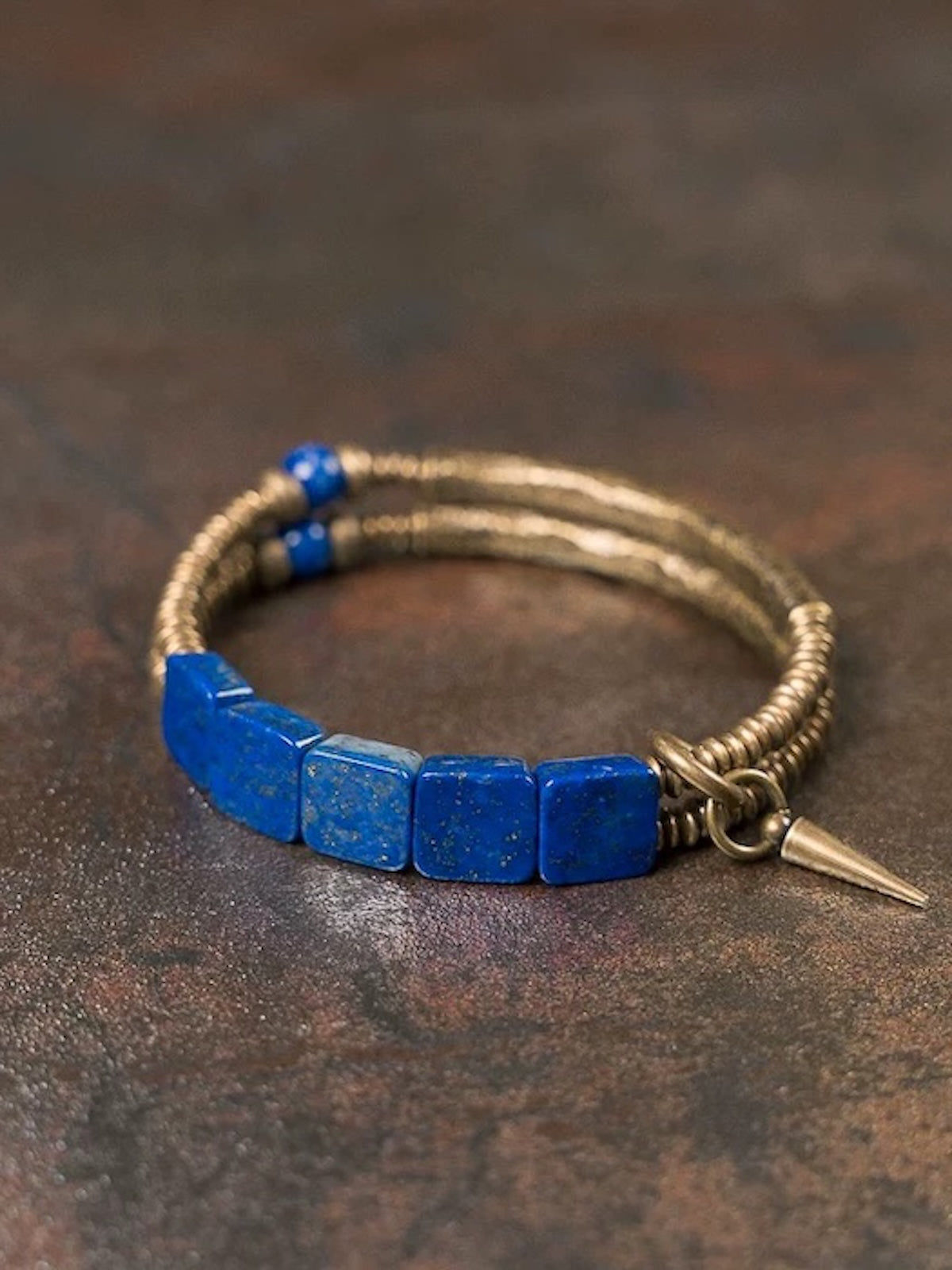 Lapis Lazuli Square Bead Bracelet featuring genuine deep-blue lapis lazuli square beads, layered bronze-toned bangles, and a vintage-inspired charm.