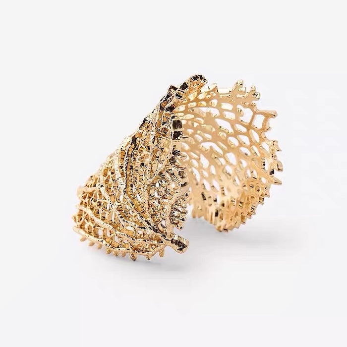 Gilded Leaf Vein Cuff Bracelet with an intricate leaf vein-inspired openwork design in gold-plated or silver-tone alloy featuring a wide sculptural silhouette.