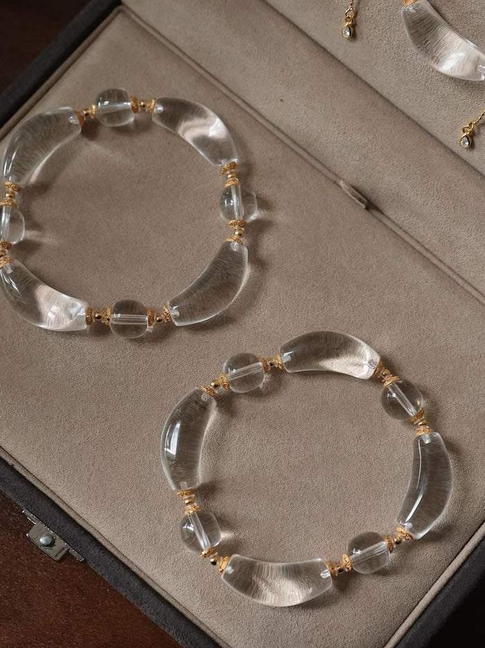 Moonlit Clear Quartz Crystal Bracelet featuring genuine moon-shaped clear quartz crystals, polished round quartz beads, and gold vermeil separation beads in a handcrafted floral-inspired design.