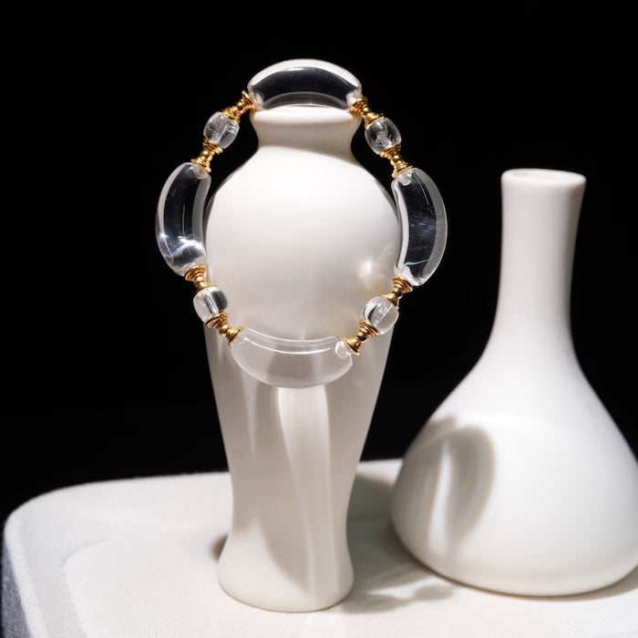 Moonlit Clear Quartz Crystal Bracelet featuring genuine moon-shaped clear quartz crystals, polished round quartz beads, and gold vermeil separation beads in a handcrafted floral-inspired design.