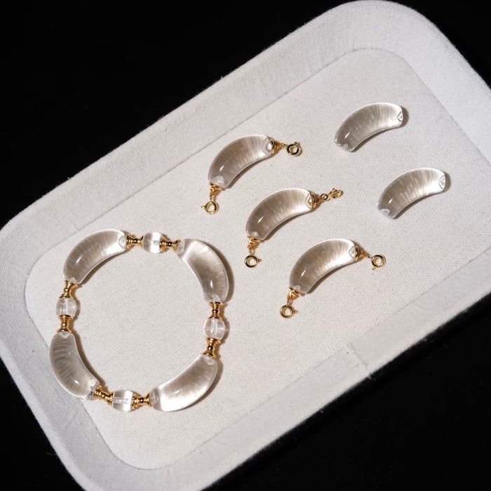 Moonlit Clear Quartz Crystal Bracelet featuring genuine moon-shaped clear quartz crystals, polished round quartz beads, and gold vermeil separation beads in a handcrafted floral-inspired design.