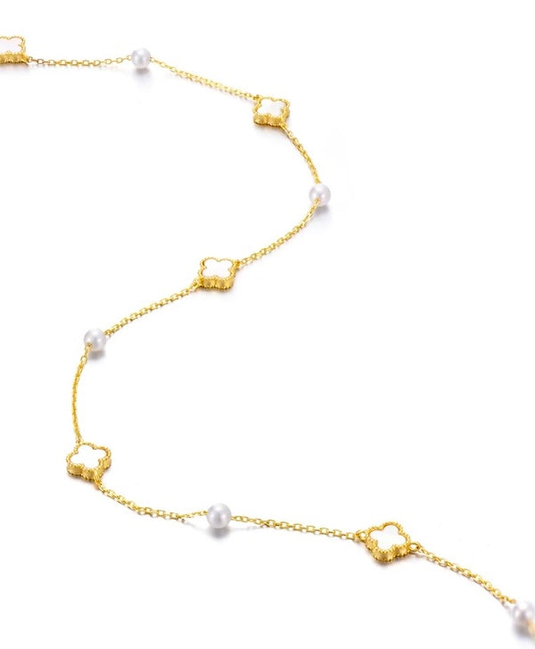 Petite Clover & Pearl Charm Necklace with white clover motifs and freshwater pearl accents, available in gold and silver.