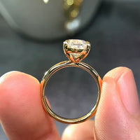 Dazzling 5CT Pigeon Egg Oval Stone Ring featuring a large oval-cut premium zirconia in a gold-plated adjustable solitaire-inspired setting.
