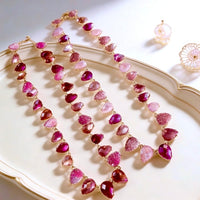 Chunky Vintage Pink Crystal Statement Necklace featuring sparkling pink crystal drop beads and matte gold plated details in a vintage-inspired statement design.
