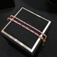 Dazzling Pink Ombré Tennis Bracelet featuring sparkling pink and clear zirconias in a gradient tennis bracelet design, available in two stone sizes.
