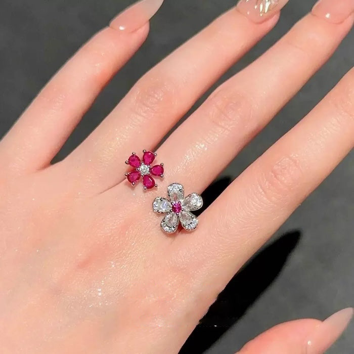 Ruby Plum Blossom Ring featuring ruby-colored and clear crystal plum blossoms on a white gold-plated adjustable band.