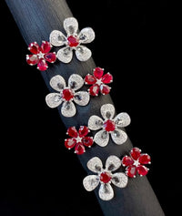 Ruby Plum Blossom Ring featuring ruby-colored and clear crystal plum blossoms on a white gold-plated adjustable band.