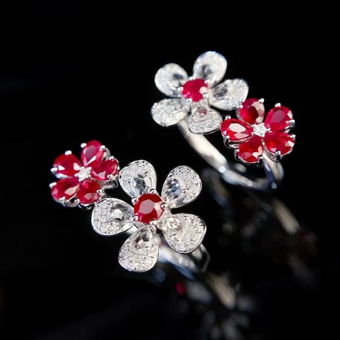 Ruby Plum Blossom Ring featuring ruby-colored and clear crystal plum blossoms on a white gold-plated adjustable band.