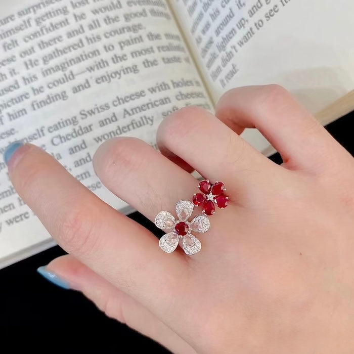 Ruby Plum Blossom Ring featuring ruby-colored and clear crystal plum blossoms on a white gold-plated adjustable band.