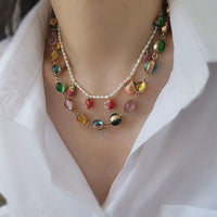 Vintage Rainbow Glass Stones Jewelry Set featuring multicolor glass stones in green, blue, pink, and amber tones linked in a gold-tone vintage-inspired necklace and bracelet design.
