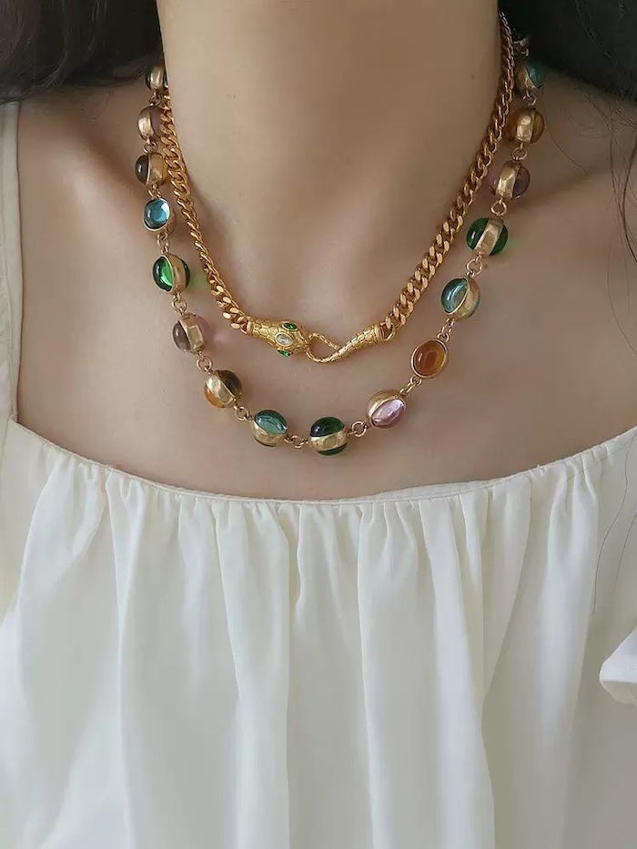 Vintage Rainbow Glass Stones Jewelry Set featuring multicolor glass stones in green, blue, pink, and amber tones linked in a gold-tone vintage-inspired necklace and bracelet design.

