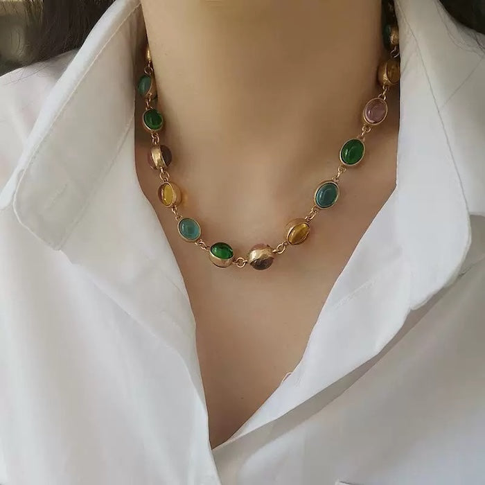 Vintage Rainbow Glass Stones Jewelry Set featuring multicolor glass stones in green, blue, pink, and amber tones linked in a gold-tone vintage-inspired necklace and bracelet design.
