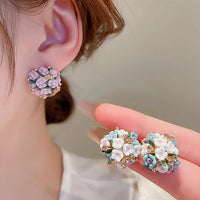 Blooming Rose Bouquet Ceramic Earrings featuring handcrafted ceramic roses, sparkling crystal accents, and rose gold-plated brass. Available in lilac or light blue for timeless vintage-inspired elegance.