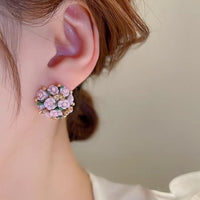 Blooming Rose Bouquet Ceramic Earrings featuring handcrafted ceramic roses, sparkling crystal accents, and rose gold-plated brass. Available in lilac or light blue for timeless vintage-inspired elegance.