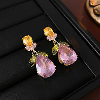 Secret Garden Crystal Jewelry Set featuring gold-plated brass with premium pink, green, yellow, and clear zirconia crystals in a botanical-inspired necklace and matching drop earrings.