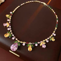 Secret Garden Crystal Jewelry Set featuring gold-plated brass with premium pink, green, yellow, and clear zirconia crystals in a botanical-inspired necklace and matching drop earrings.