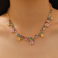 Secret Garden Crystal Jewelry Set featuring gold-plated brass with premium pink, green, yellow, and clear zirconia crystals in a botanical-inspired necklace and matching drop earrings.