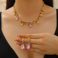 Secret Garden Crystal Jewelry Set featuring gold-plated brass with premium pink, green, yellow, and clear zirconia crystals in a botanical-inspired necklace and matching drop earrings.
