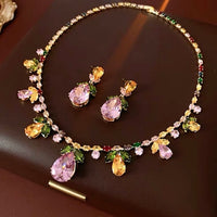 Secret Garden Crystal Jewelry Set featuring gold-plated brass with premium pink, green, yellow, and clear zirconia crystals in a botanical-inspired necklace and matching drop earrings.