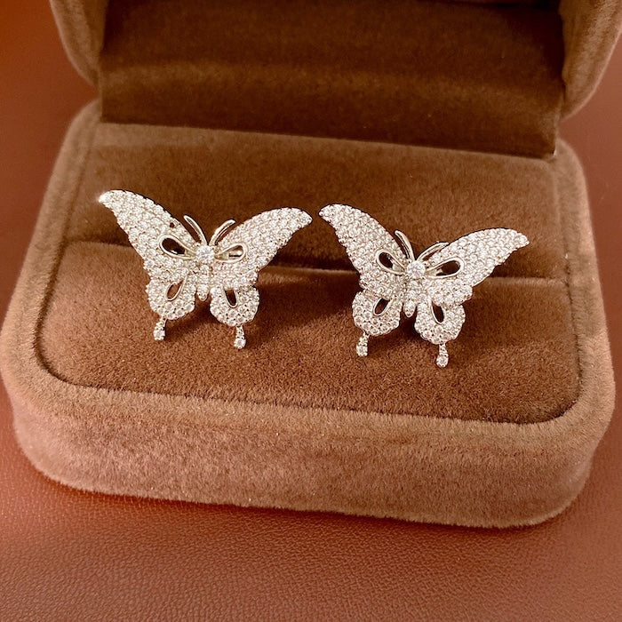 Enchanted Butterfly Ear Cuff in silver-plated brass featuring a butterfly silhouette with premium-grade zirconias, designed as an elegant ear cuff and sold as one pair.