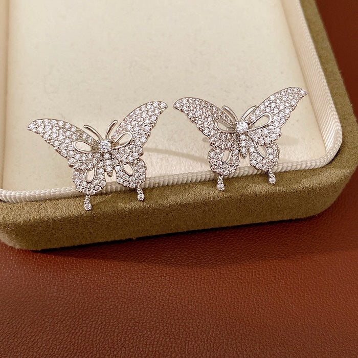 Enchanted Butterfly Ear Cuff in silver-plated brass featuring a butterfly silhouette with premium-grade zirconias, designed as an elegant ear cuff and sold as one pair.