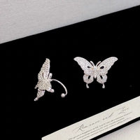 Enchanted Butterfly Ear Cuff in silver-plated brass featuring a butterfly silhouette with premium-grade zirconias, designed as an elegant ear cuff and sold as one pair.