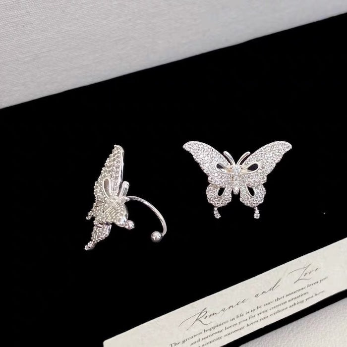 Enchanted Butterfly Ear Cuff in silver-plated brass featuring a butterfly silhouette with premium-grade zirconias, designed as an elegant ear cuff and sold as one pair.
