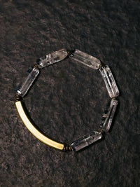 Clear Quartz Bar Bracelet featuring genuine clear quartz stone bars, bronze-toned findings, and a vintage-inspired charm.