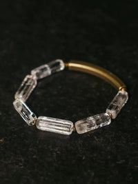 Clear Quartz Bar Bracelet featuring genuine clear quartz stone bars, bronze-toned findings, and a vintage-inspired charm.