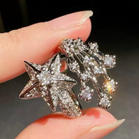 Radiant Starfall jewelry set featuring sparkling celestial star stud earrings and a matching adjustable ring crafted in white gold plated brass with premium grade zirconia.
