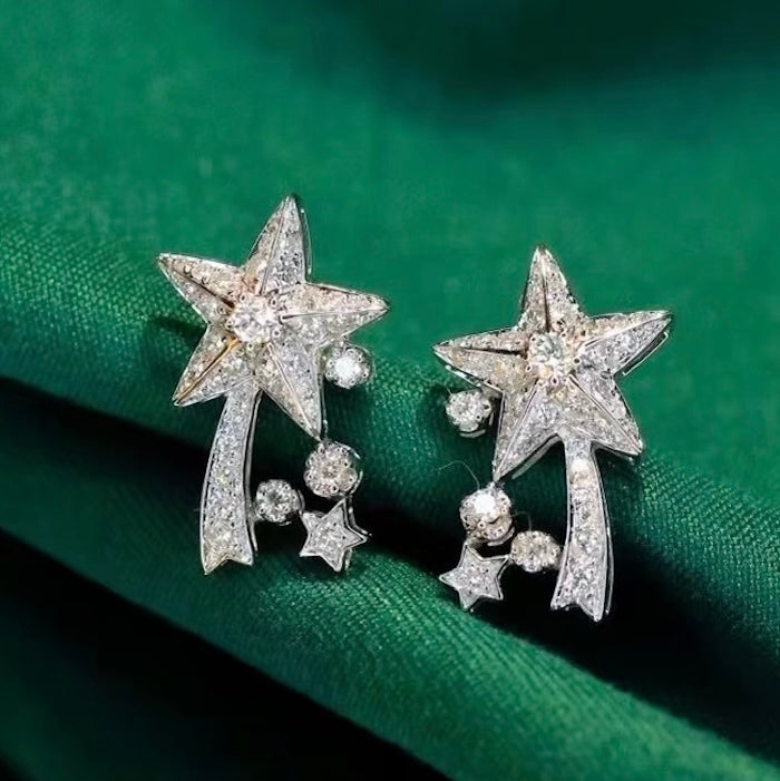 Radiant Starfall jewelry set featuring sparkling celestial star stud earrings and a matching adjustable ring crafted in white gold plated brass with premium grade zirconia.
