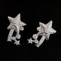 Radiant Starfall jewelry set featuring sparkling celestial star stud earrings and a matching adjustable ring crafted in white gold plated brass with premium grade zirconia.
