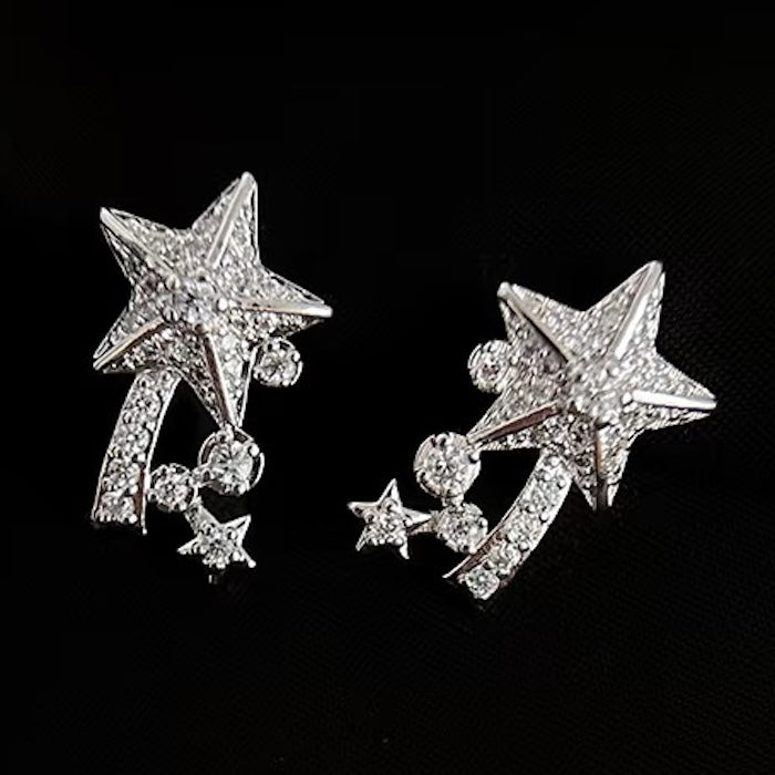 Radiant Starfall jewelry set featuring sparkling celestial star stud earrings and a matching adjustable ring crafted in white gold plated brass with premium grade zirconia.
